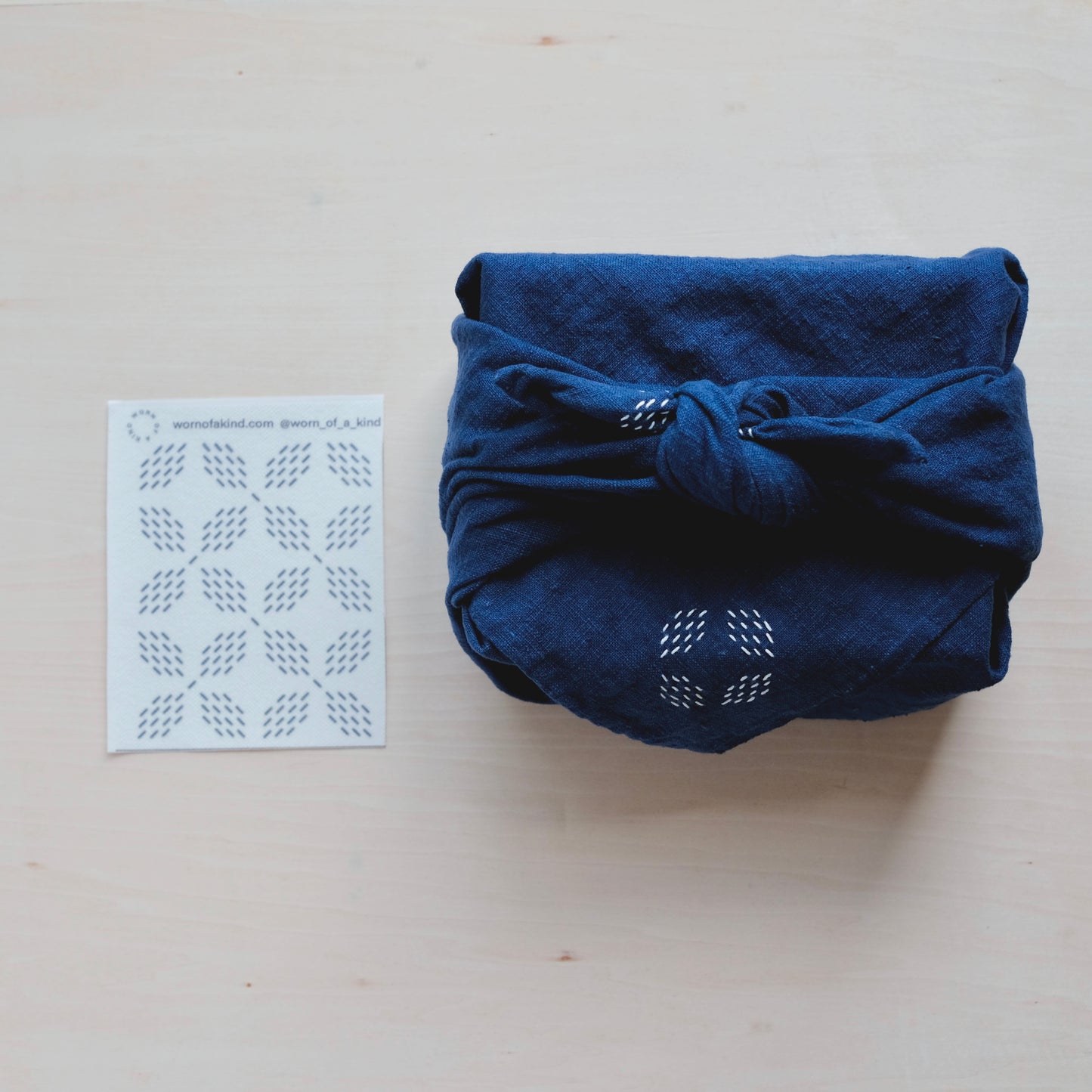 Flower Diamond Sashiko pattern sheet and a sample stitched on an indigo Furoshiki gift wrap.