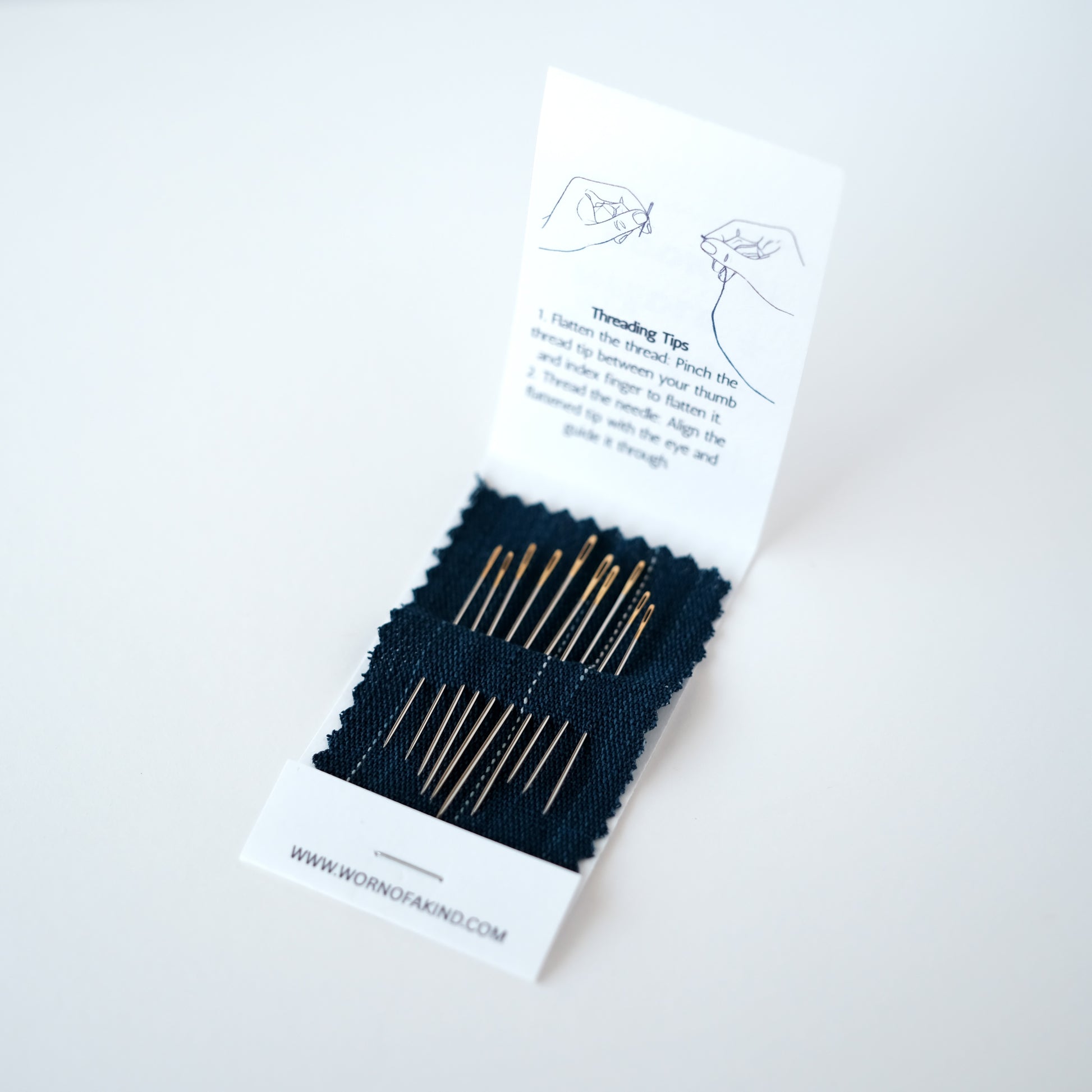 Sashiko needle set with 10 assorted needles in an indigo fabric booklet.
