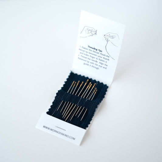 Sashiko needle set with 10 assorted needles in an indigo fabric booklet.