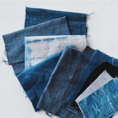 Curated Boro fabric bundle featuring 10 pieces of antique indigo hand woven cotton and French linen textiles.