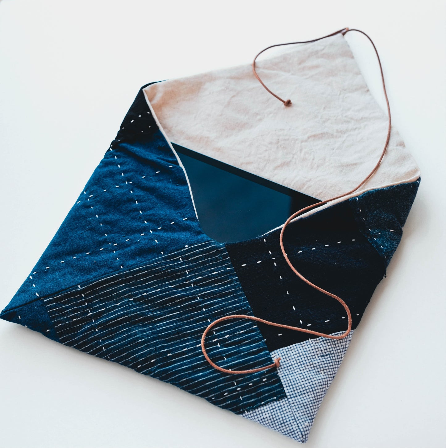 Hand-stitched Boro patchwork tablet sleeve made from vintage indigo fabrics.