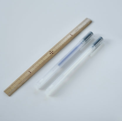Blue and white fabric pens shown next to a traditional Japanese bamboo ruler.