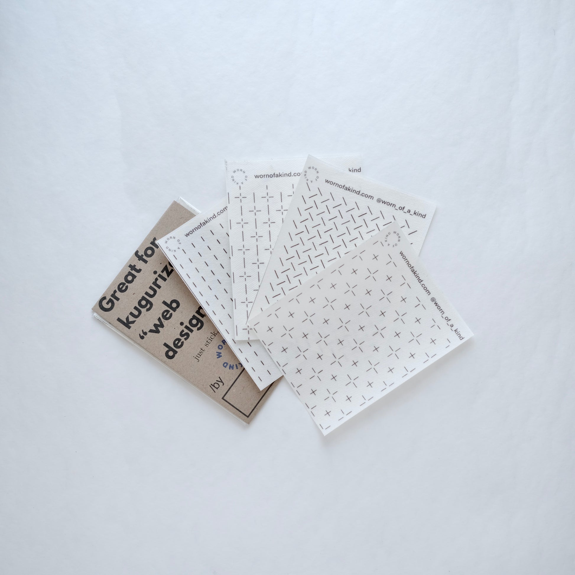 A pack of 4 Great for Kugurizashi stick and stitch Sashiko pattern stickers with eco-friendly cover.