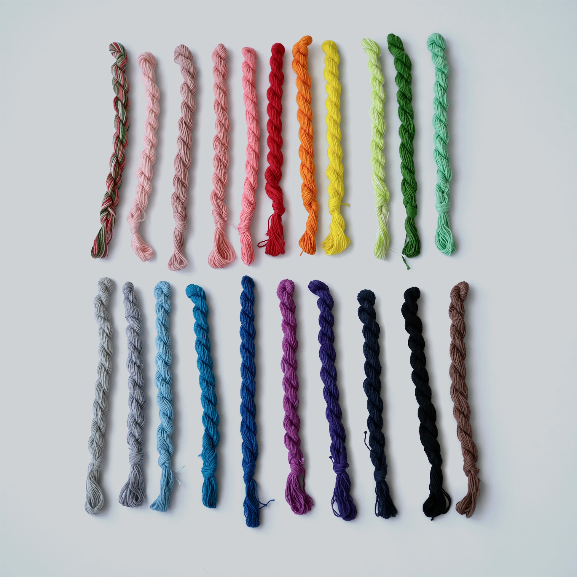 Selection of 21 different colors of 20-meter sashiko thread samples, ideal for small visible mending repairs and colorful accents.