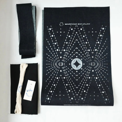 DIY Sashiko kit contents: pre-cut heavy duty denim, cotton lining, 30m thread, and needle.
