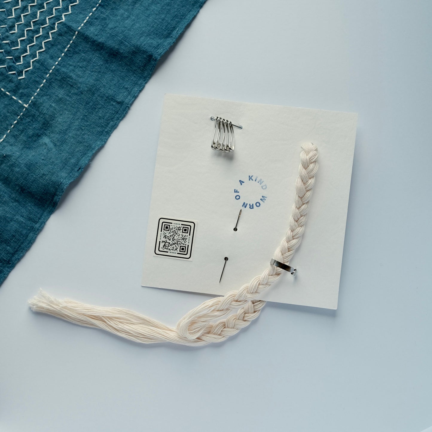 Back of the Sashiko Starter Kit card showing the QR code for video instructions and the tool layout.