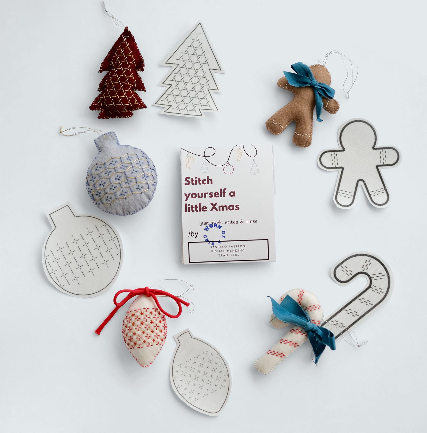 Sashiko Christmas Ornament Kit with 5 wool felt ornaments and matching Stick 'n Stitch transfers.