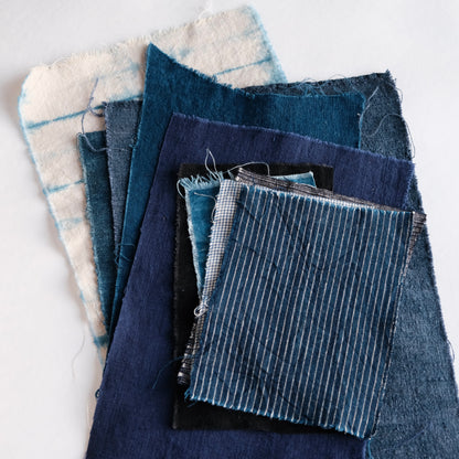 The complete 10-piece Boro fabric bundle laid out to show all indigo and linen variations.