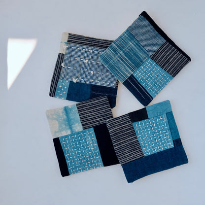 Four unique hand-patched coasters showing different antique indigo textures.